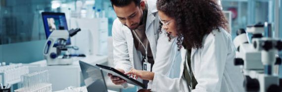 Science, teamwork and scientist with tablet in laboratory for communication, pharmaceutical review or planning. Employees, collaboration and technology for research, discussion and digital analysis